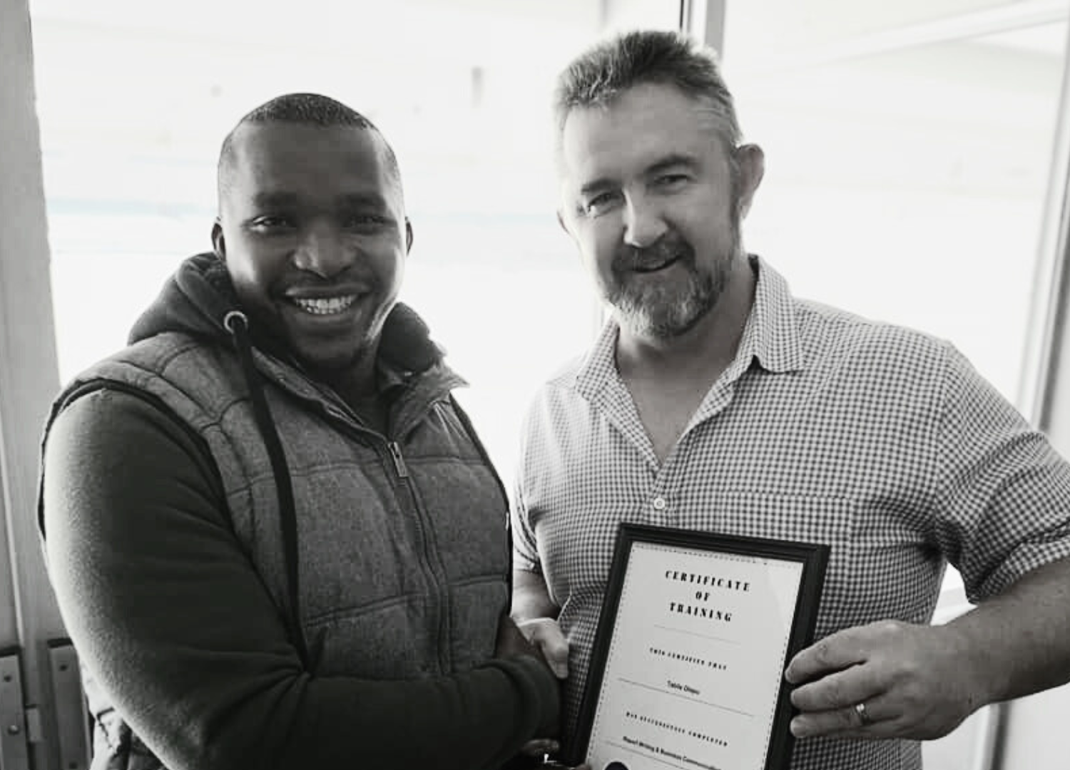 Tutor Awarding Certificate GL Training tutor awarding a certificate to a delegate